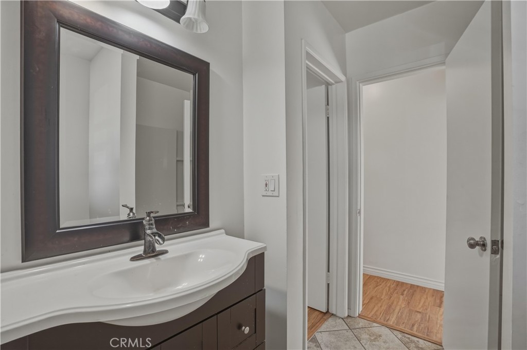 14808 Aztec Street Sylmar, CA 91342 - Photo 10 of 23 a bathroom with a sink and a mirror