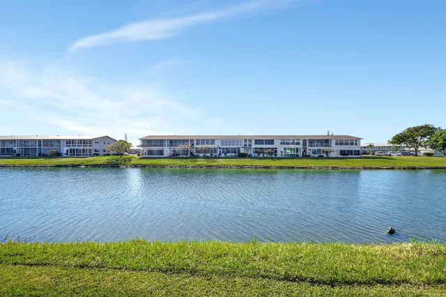a view of a swimming pool and a yard