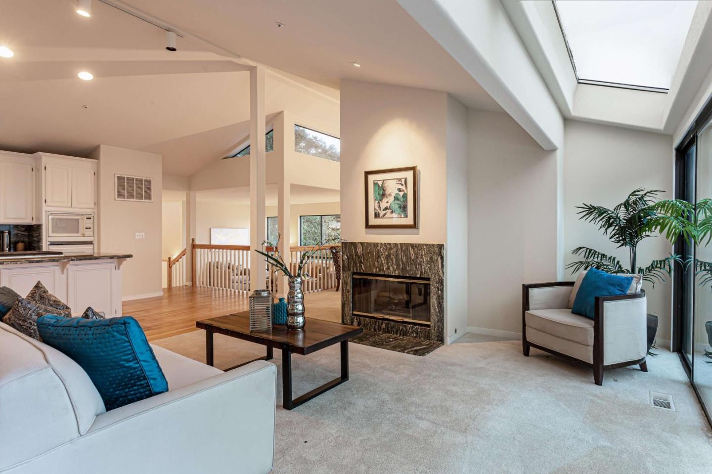 745 Holly Road Belmont, CA 94002 - Photo 12 of 50 a living room with furniture and a fireplace