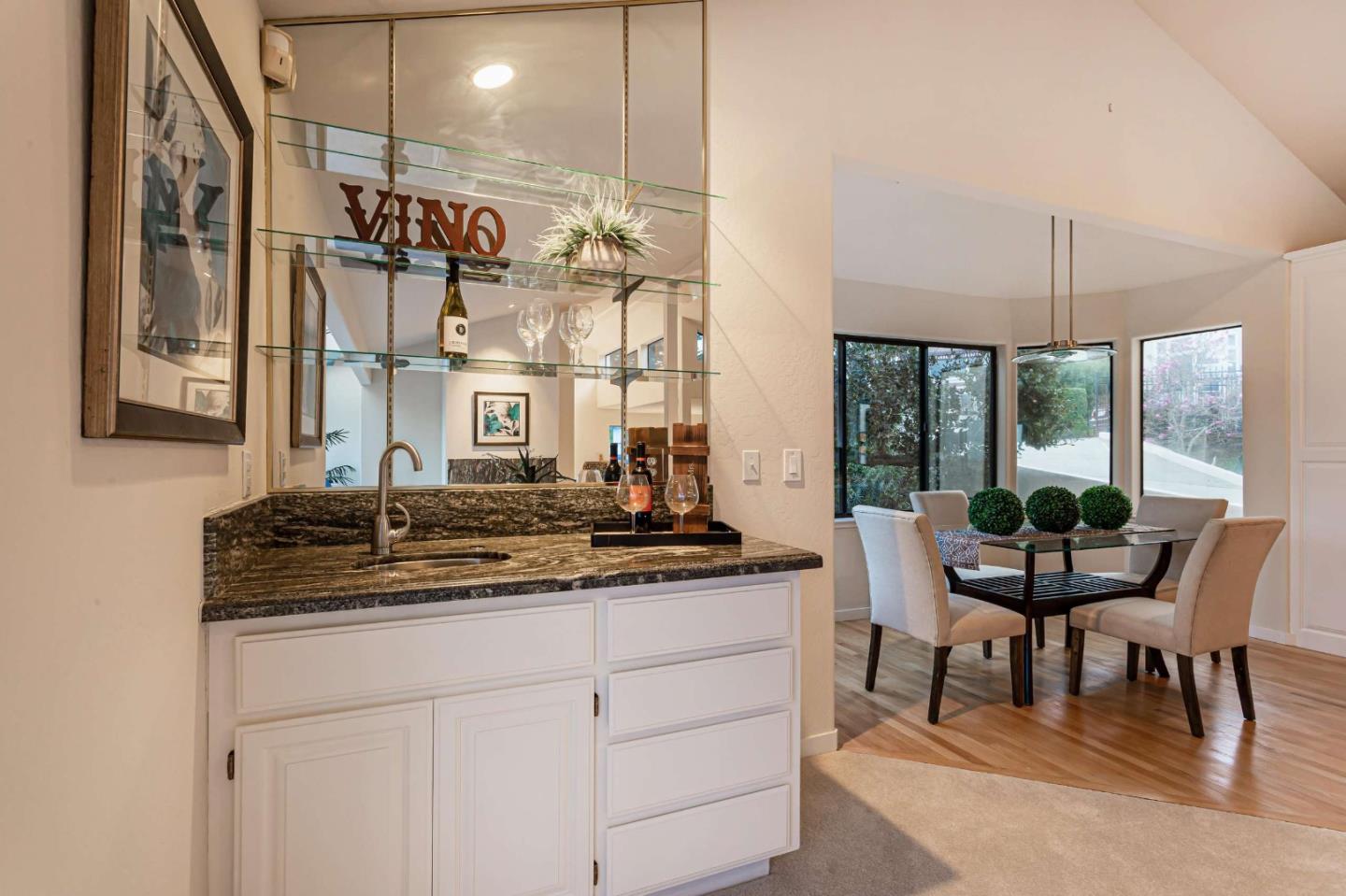 745 Holly Road Belmont, CA 94002 - Photo 14 of 50 a kitchen with a table and chairs