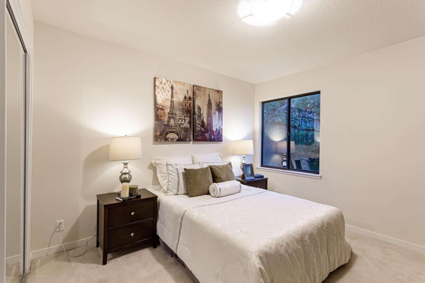 745 Holly Road Belmont, CA 94002 - Photo 21 of 50 a bedroom with a bed and window