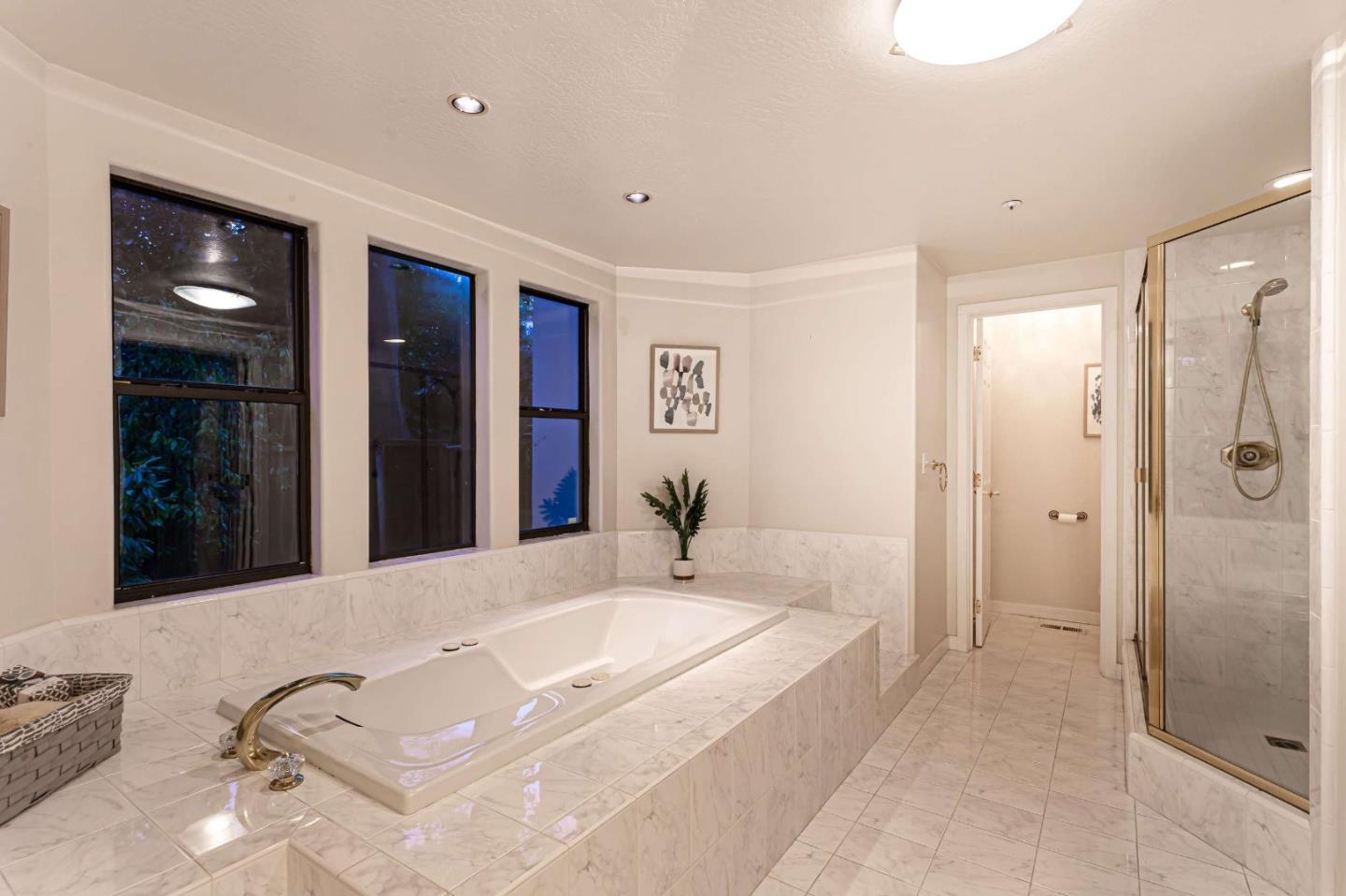 745 Holly Road Belmont, CA 94002 - Photo 30 of 50 a spacious bathroom with a tub shower and mirror