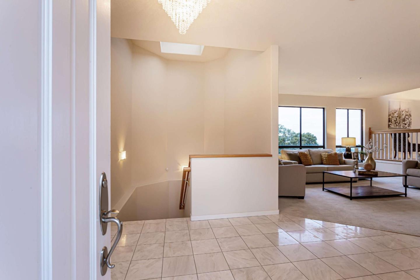 745 Holly Road Belmont, CA 94002 - Photo 3 of 50 a living room with furniture and a large window