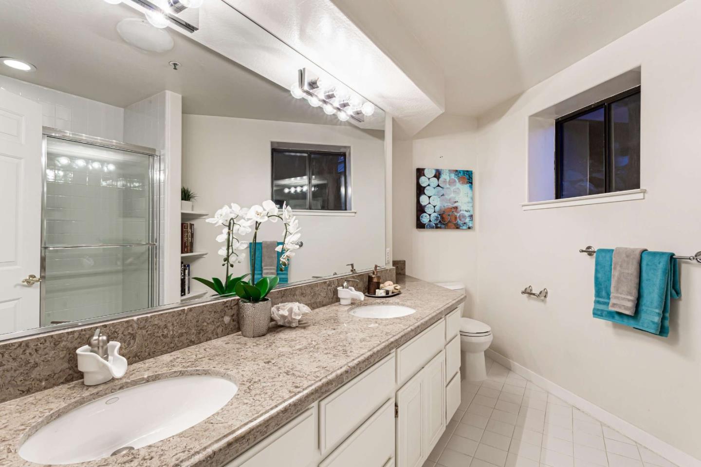 745 Holly Road Belmont, CA 94002 - Photo 32 of 50 a bathroom with a granite countertop sink mirror and shower