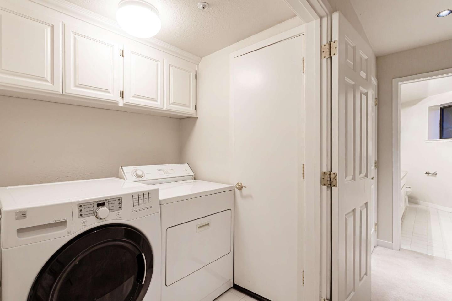 745 Holly Road Belmont, CA 94002 - Photo 34 of 50 a view of storage and utility room with washer and dryer