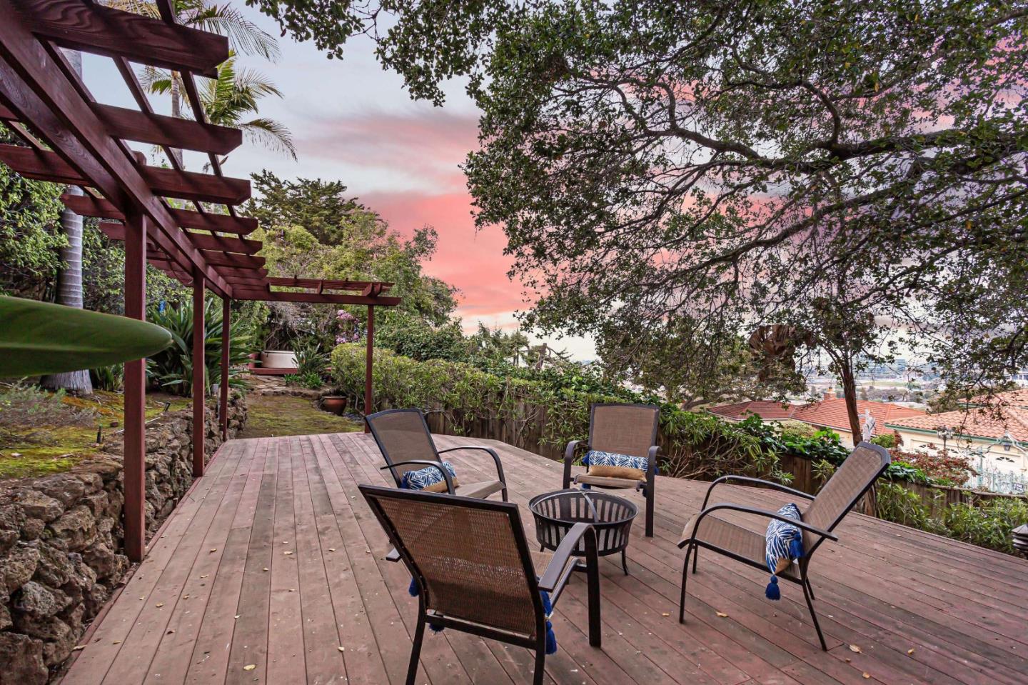745 Holly Road Belmont, CA 94002 - Photo 49 of 50 a view of a patio with table and chairs and wooden floor