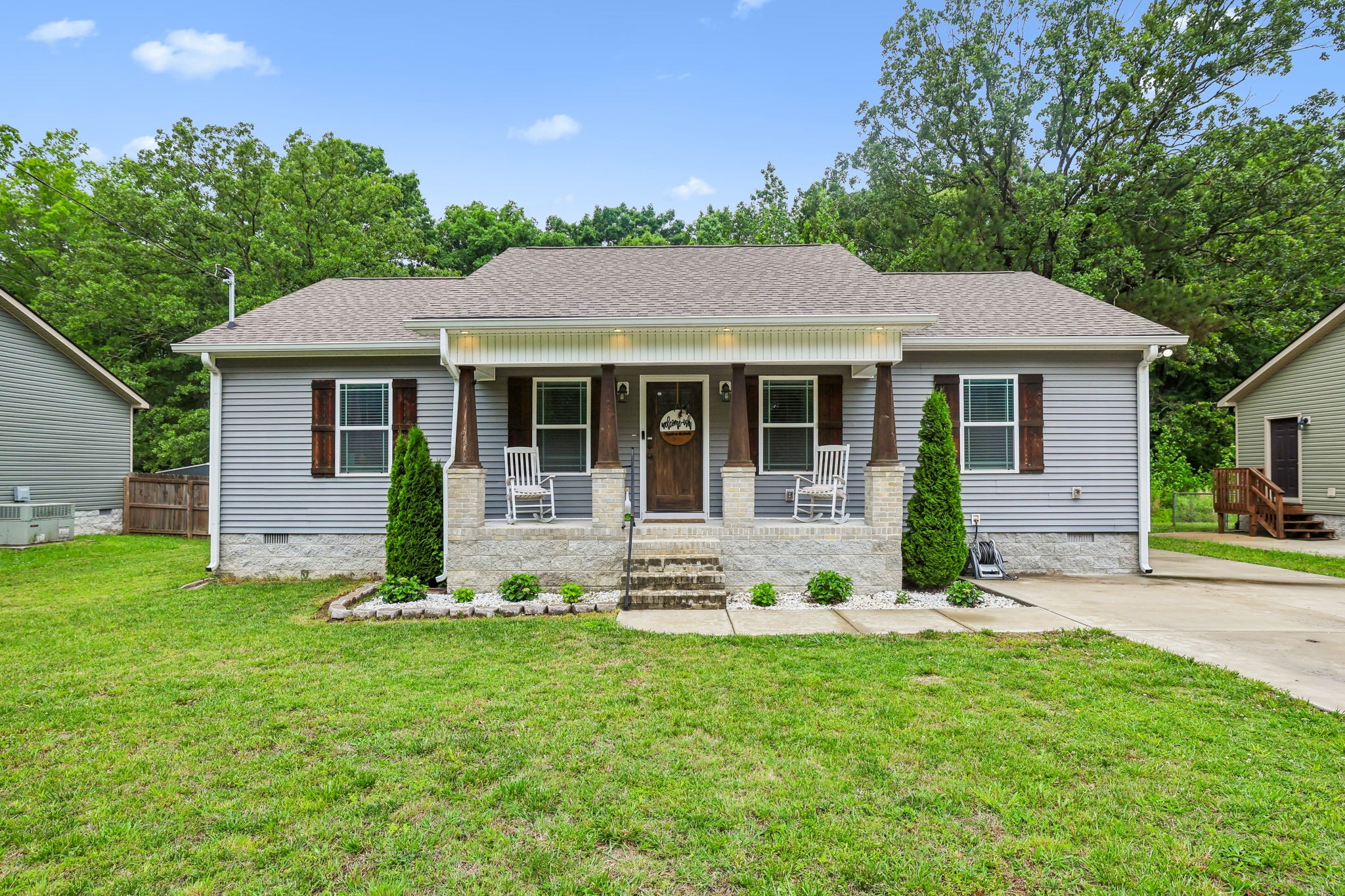 1546 South Spring Street Manchester, TN 37355 - Photo 1 of 53 a front view of a house with a yard and porch