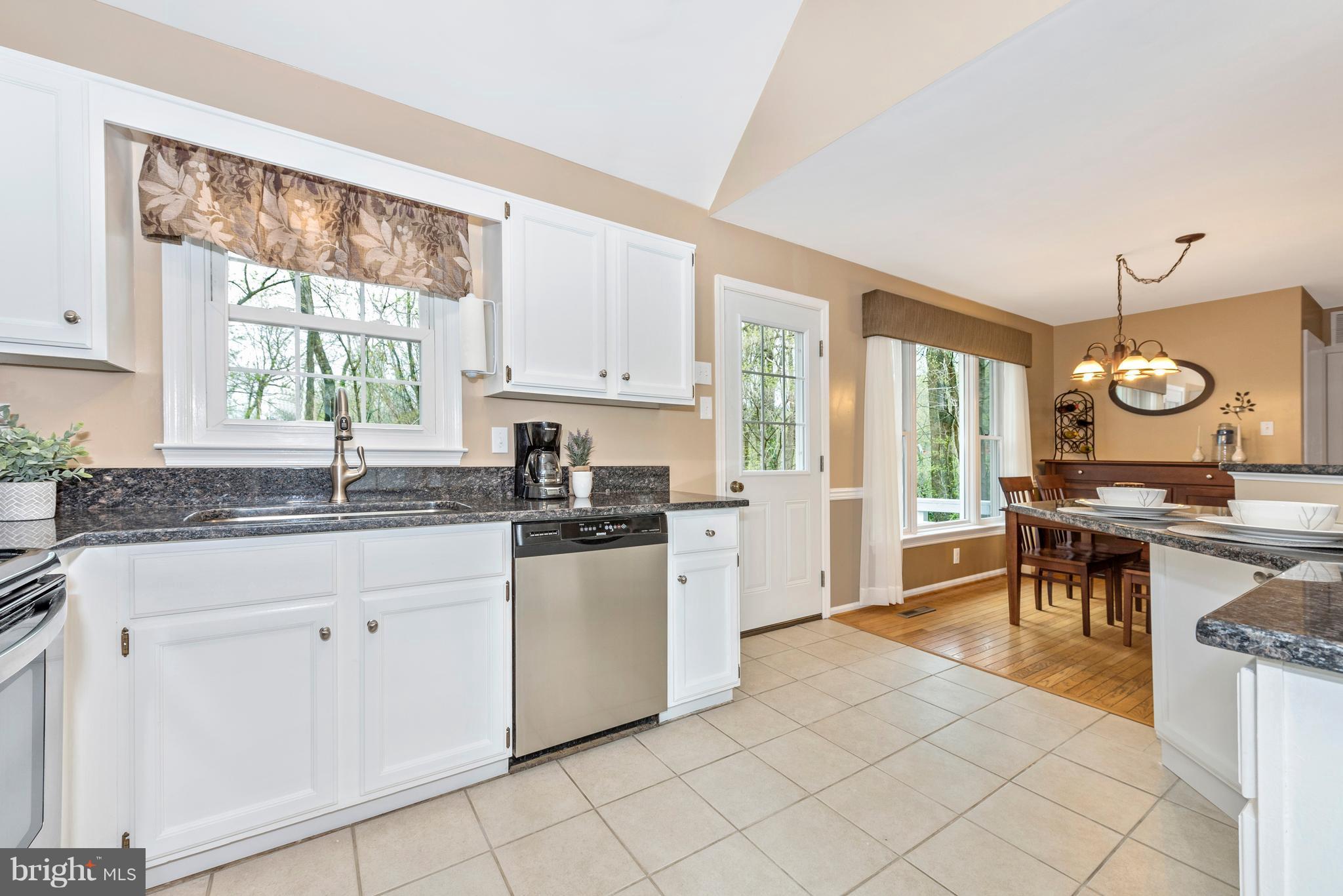 1706 Brookshire Run Point of Rocks, MD 21777 - Photo 11 of 29 a kitchen with granite countertop white cabinets and white appliances