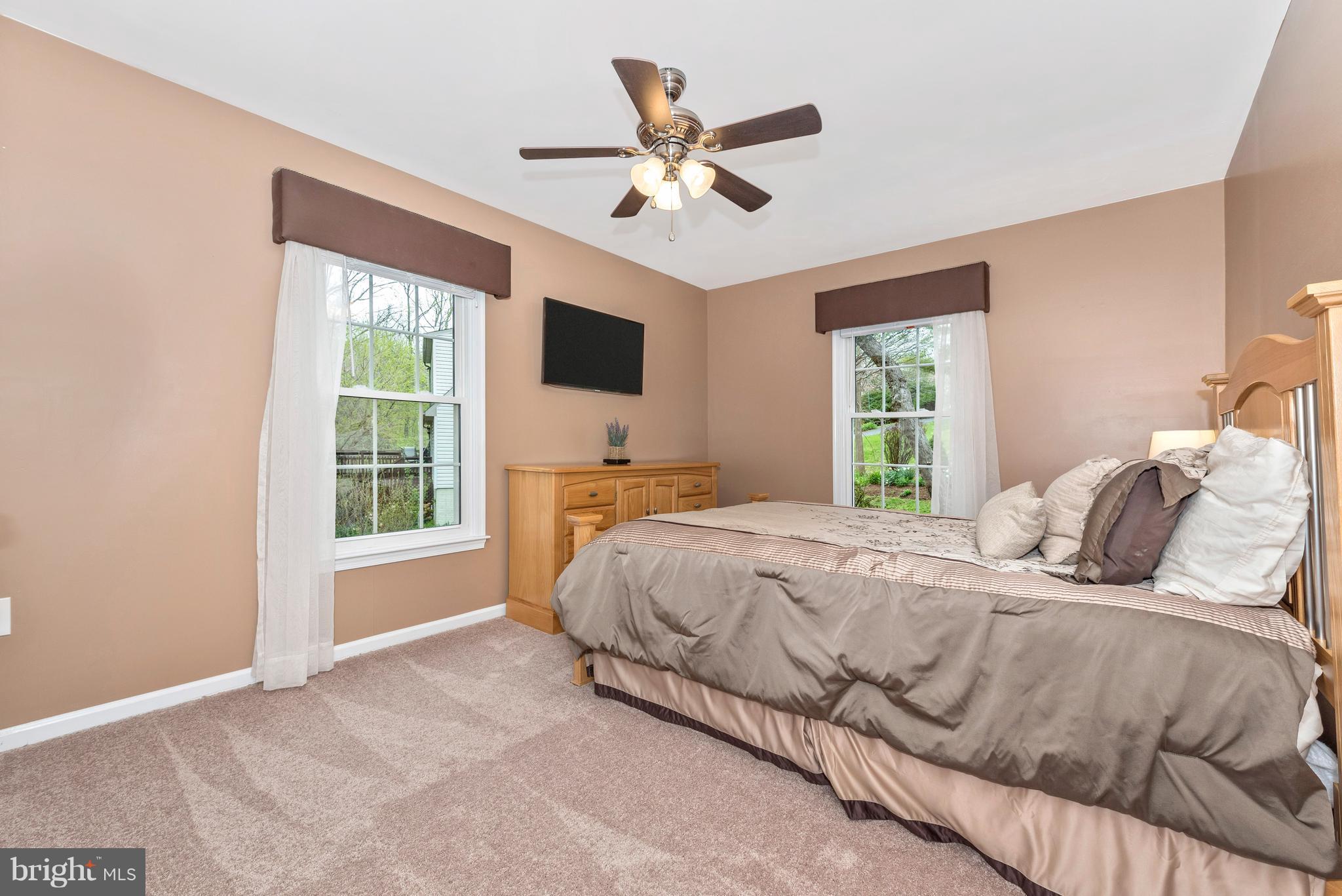 1706 Brookshire Run Point of Rocks, MD 21777 - Photo 12 of 29 a bedroom with a large bed and a large window
