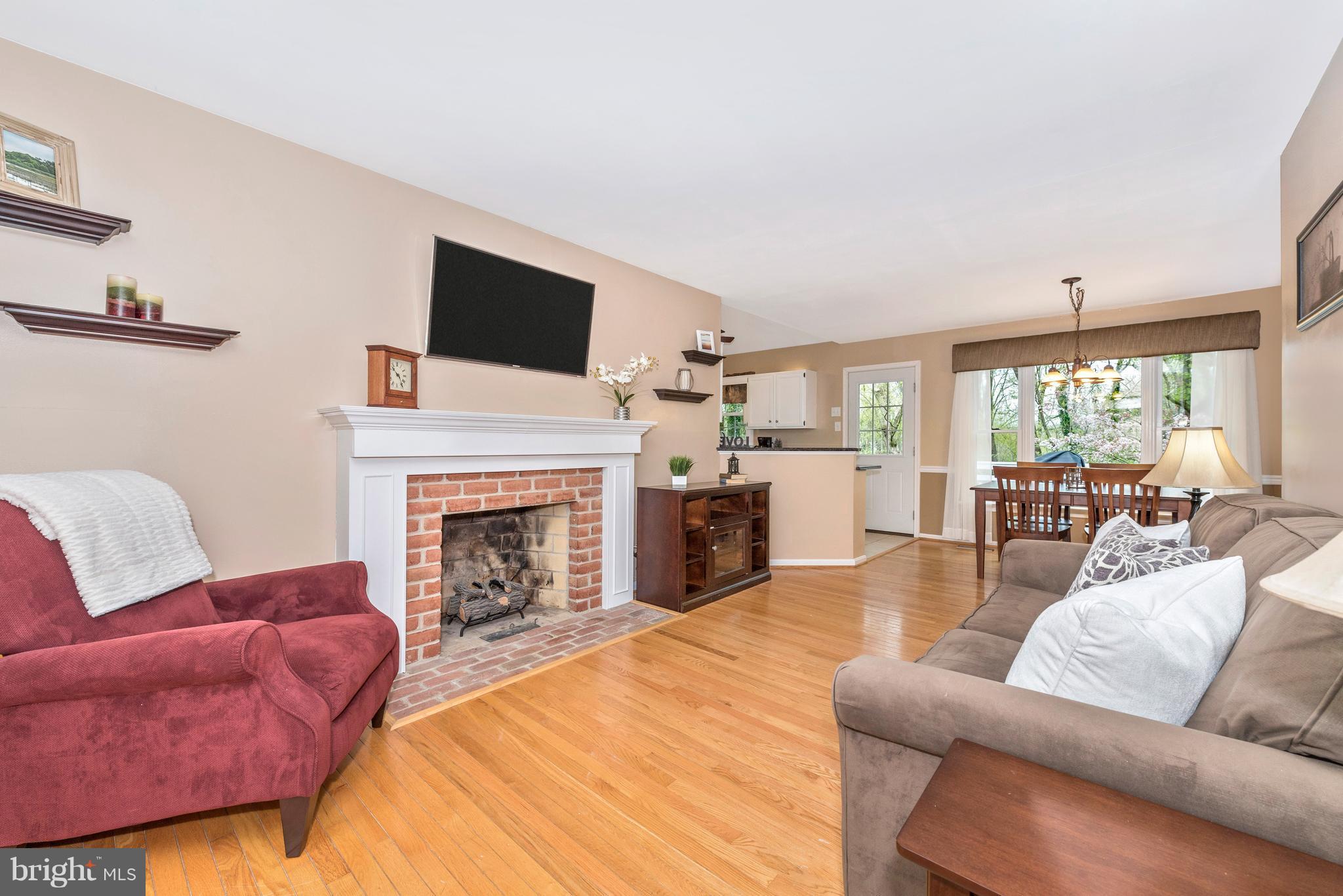 1706 Brookshire Run Point of Rocks, MD 21777 - Photo 3 of 29 a living room with furniture fireplace and flat screen tv