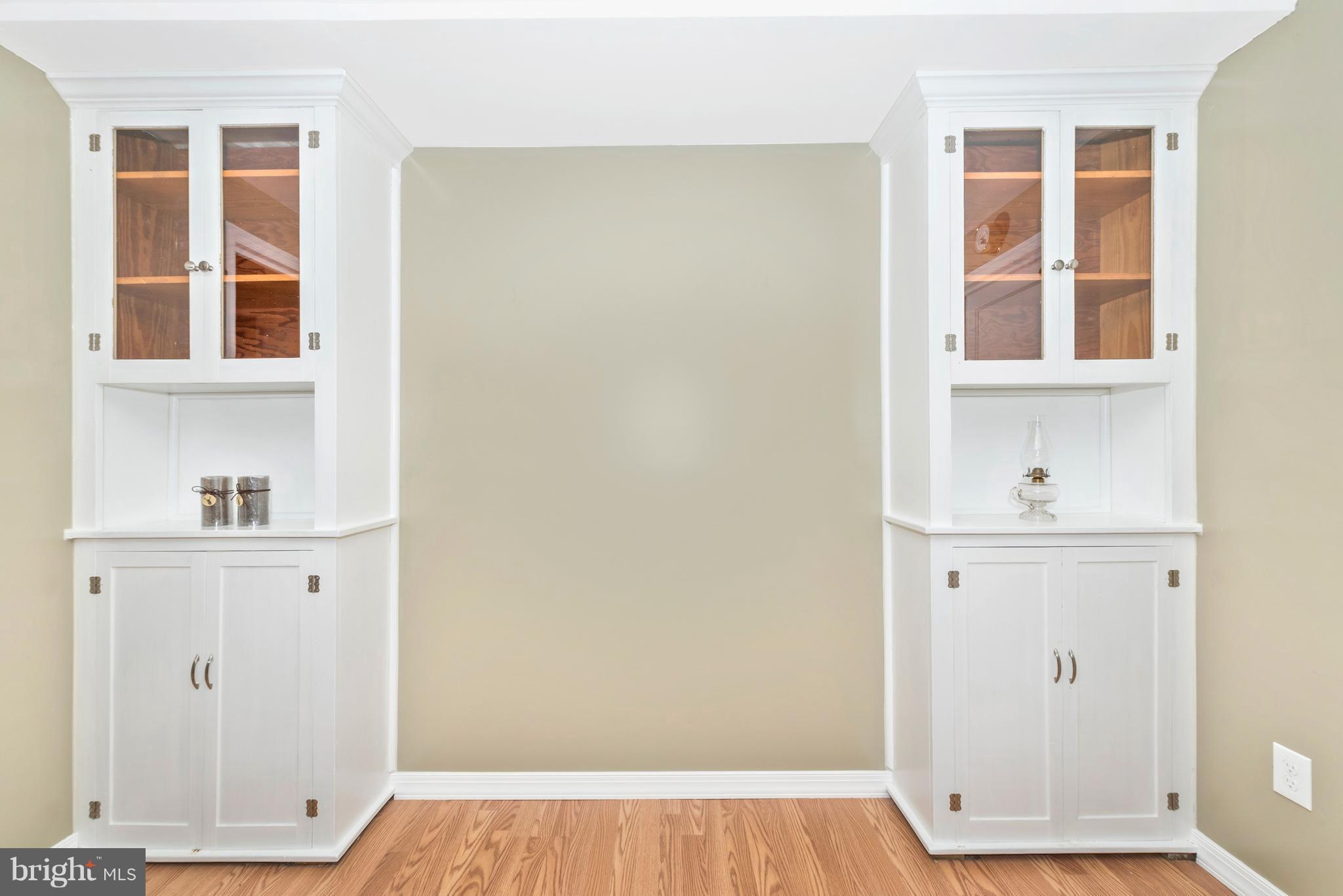 1706 Brookshire Run Point of Rocks, MD 21777 - Photo 20 of 29 a view of an empty room with wooden floor and cabinets
