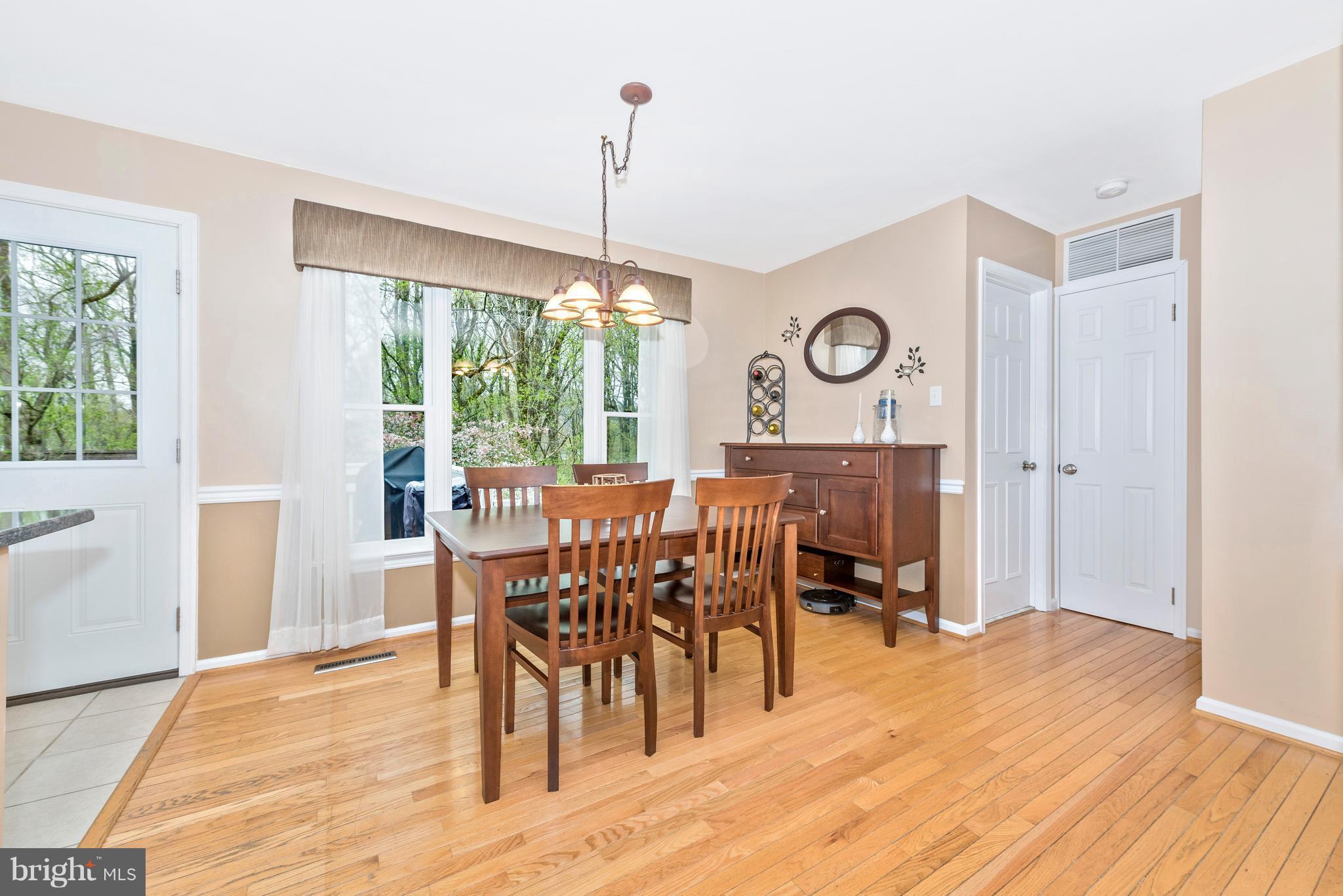 1706 Brookshire Run Point of Rocks, MD 21777 - Photo 7 of 29 a view of a dining room with furniture window and wooden floor