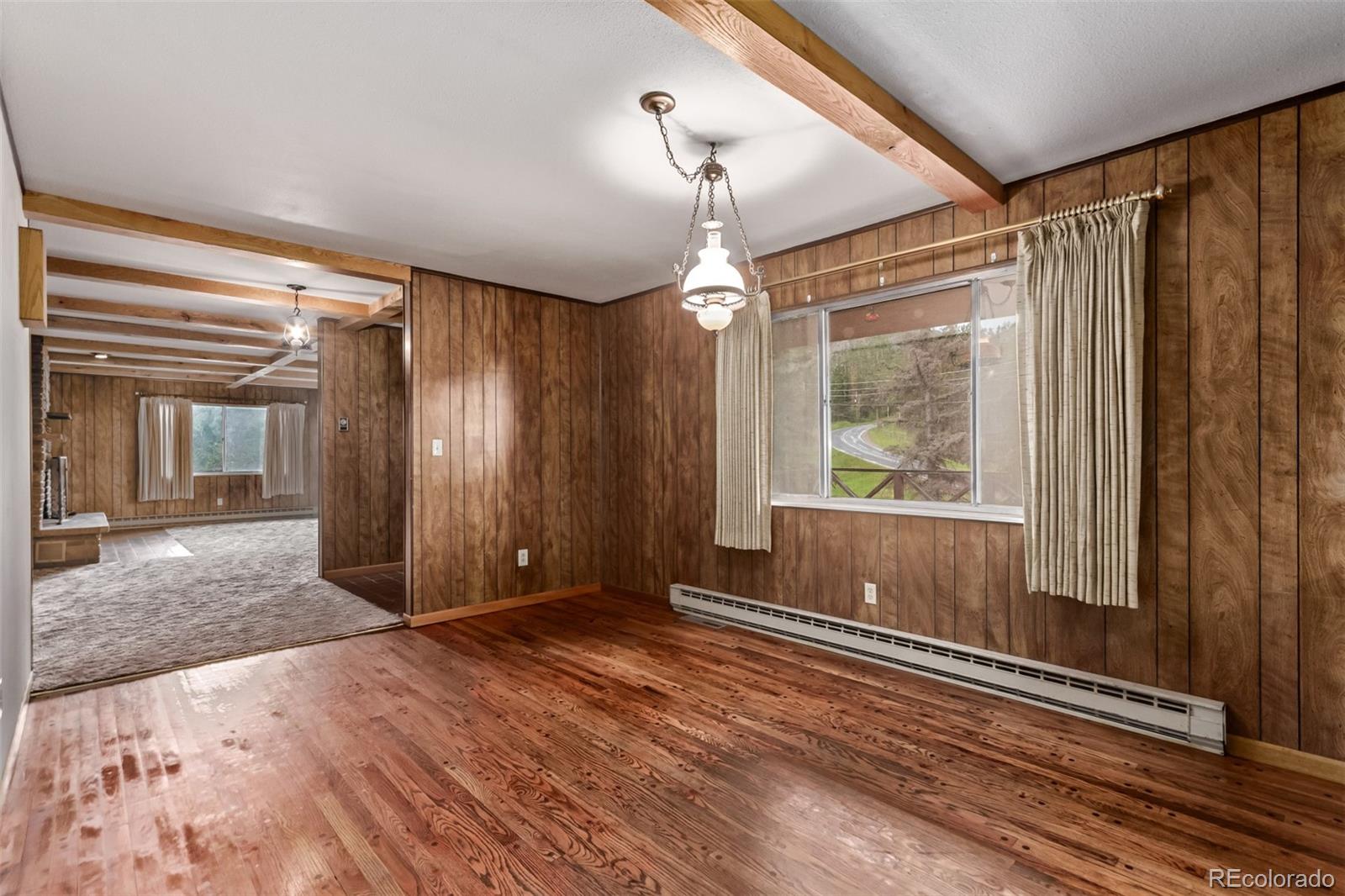 15481 Rist Canyon Road Bellvue, CO 80512 - Photo 12 of 50 a view of a room with wooden floor and windows
