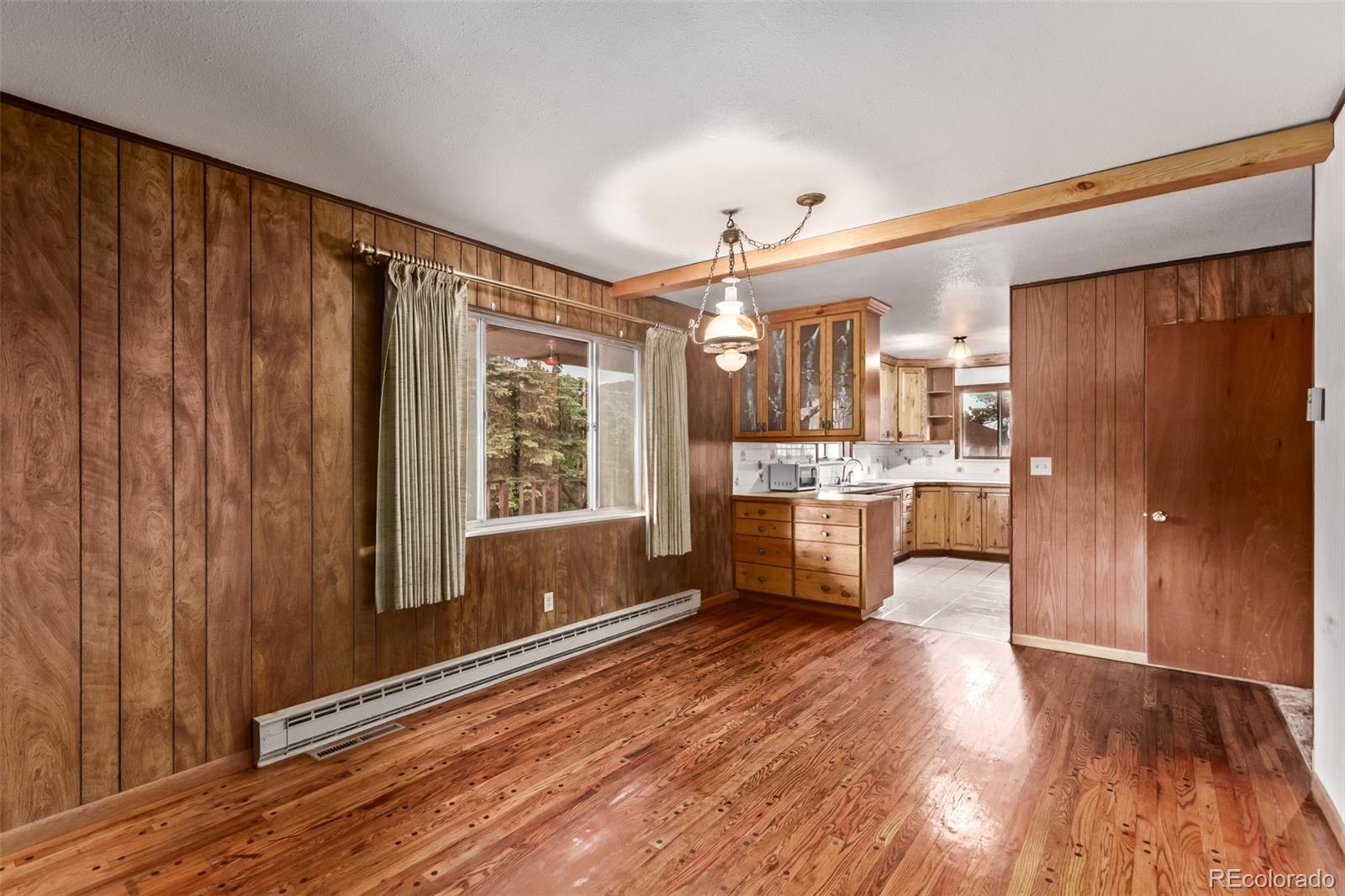 15481 Rist Canyon Road Bellvue, CO 80512 - Photo 13 of 50 a large kitchen with lot of counter space and wooden floor