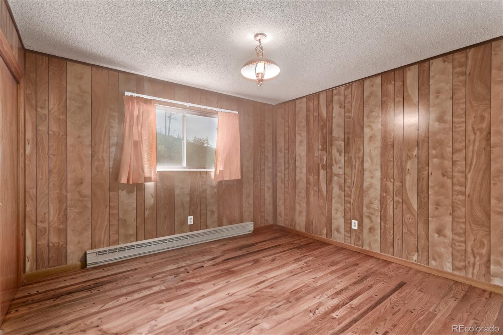 15481 Rist Canyon Road Bellvue, CO 80512 - Photo 21 of 50 a view of entryway with wooden floor
