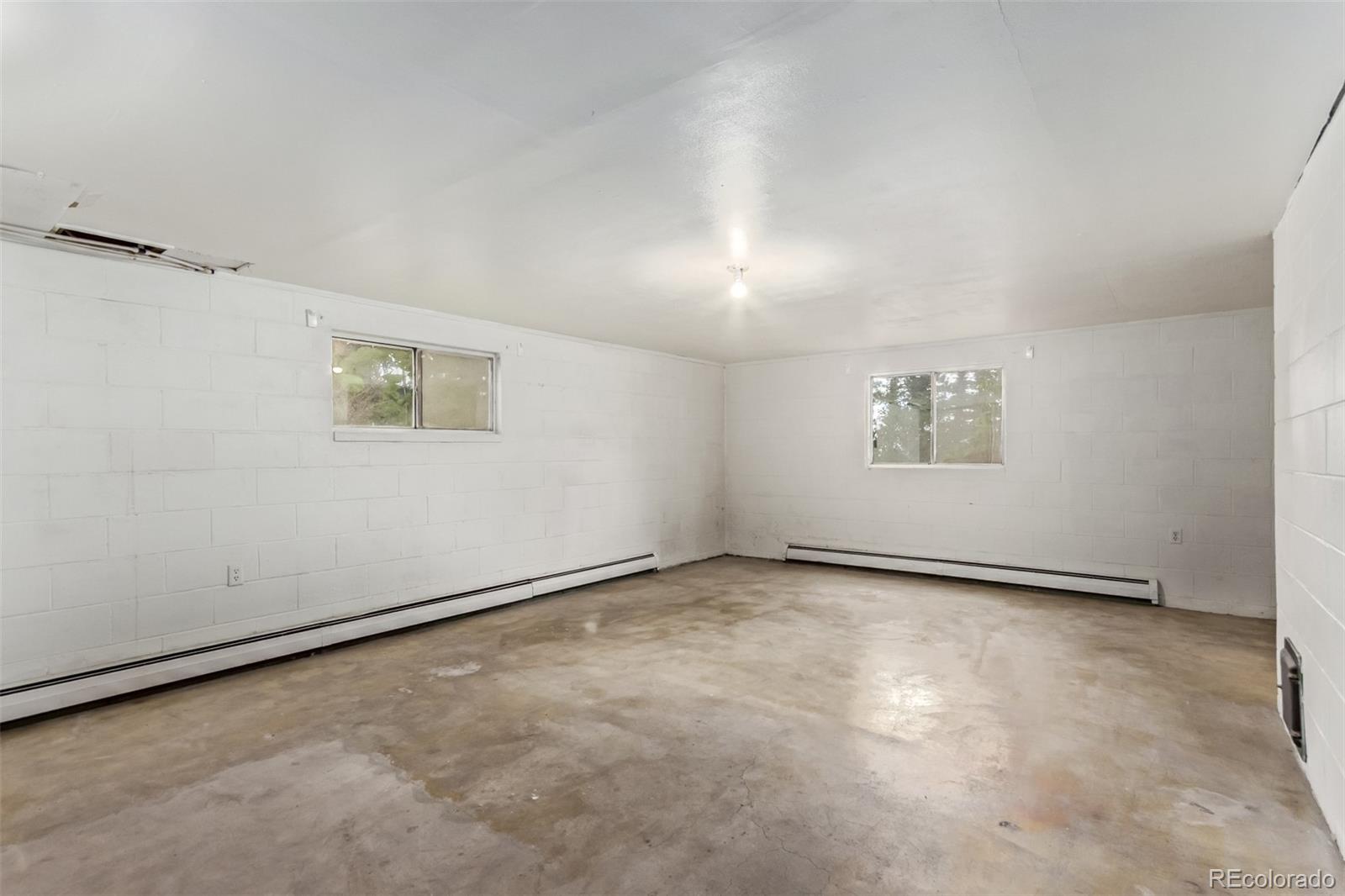 15481 Rist Canyon Road Bellvue, CO 80512 - Photo 29 of 50 an empty room with a empty space and window