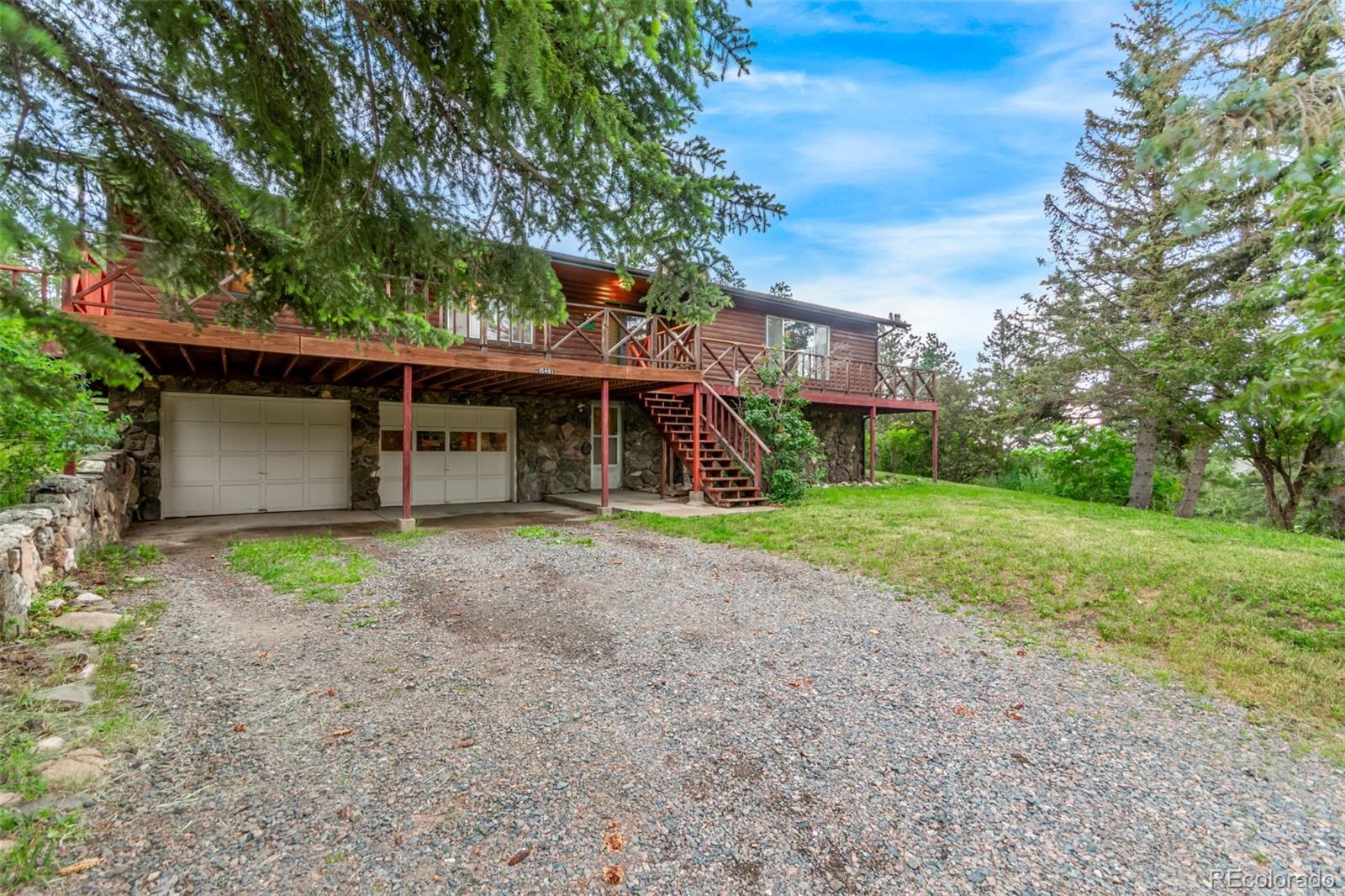 15481 Rist Canyon Road Bellvue, CO 80512 - Photo 4 of 50 a view of a house with a yard
