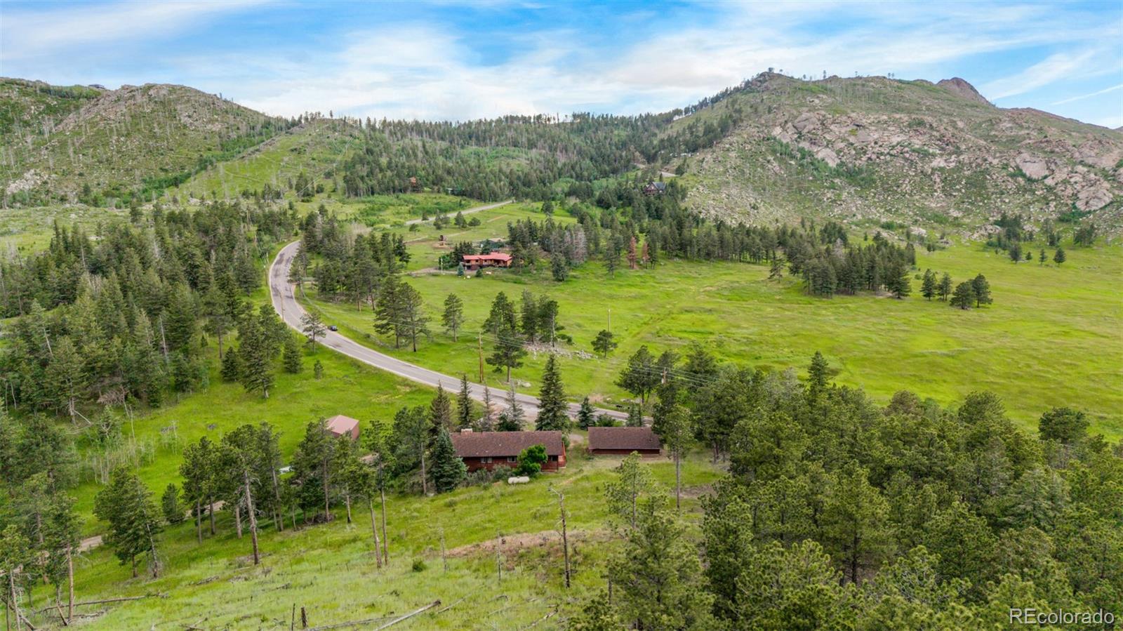 15481 Rist Canyon Road Bellvue, CO 80512 - Photo 44 of 50 a view of a garden with a houses