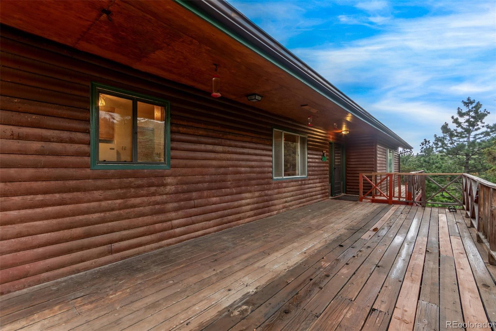 15481 Rist Canyon Road Bellvue, CO 80512 - Photo 7 of 50 a view of a house with wooden floor