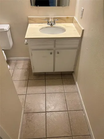 a bathroom with a sink toilet and tub