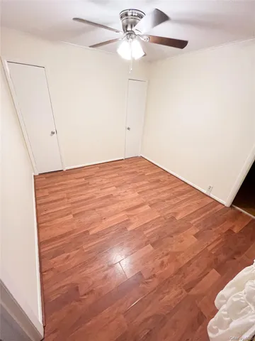 a view of empty room with ceiling fan