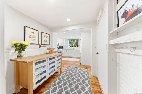 a room with a bed and a chandelier