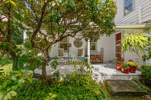 front view of a house with a tree