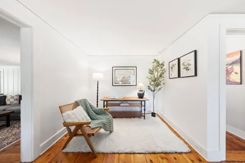 a living room with furniture and a rug