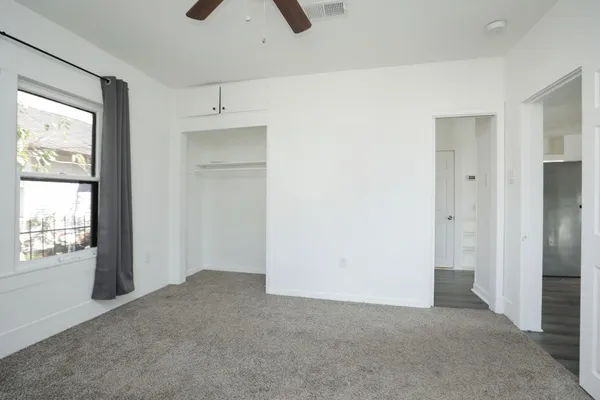 a view of an empty room with a window