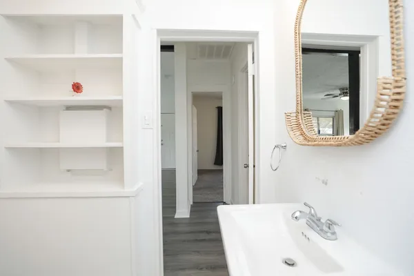 a bathroom with a bathtub and a sink
