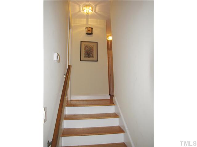 103 Dabney Road Cary, NC 27511 - Photo 11 of 25 a view of a hallway with wooden floor