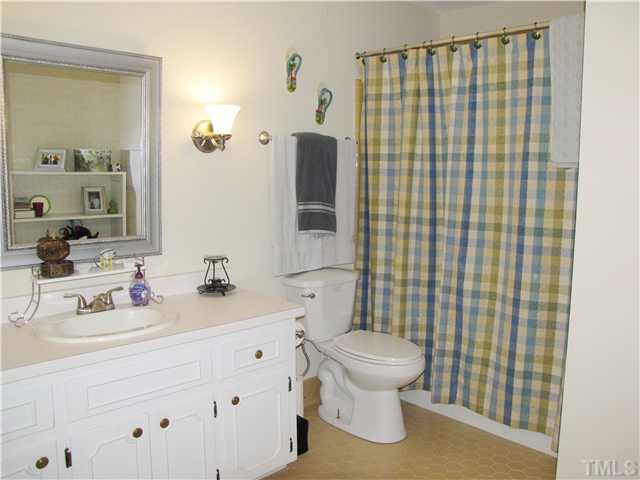 103 Dabney Road Cary, NC 27511 - Photo 15 of 25 a bathroom with a sink toilet and shower