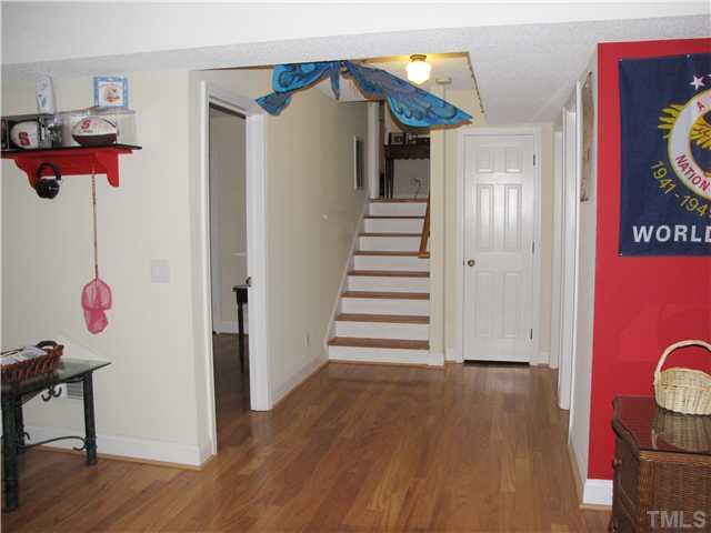 103 Dabney Road Cary, NC 27511 - Photo 17 of 25 a view of entryway with wooden floor
