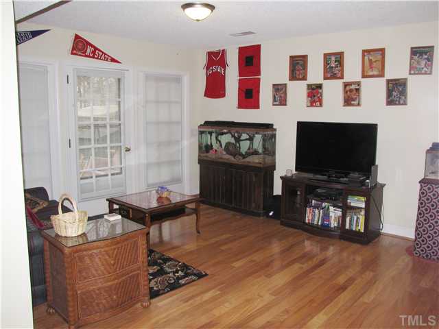 103 Dabney Road Cary, NC 27511 - Photo 19 of 25 a living room with furniture and a flat screen tv