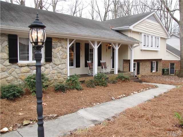 103 Dabney Road Cary, NC 27511 - Photo 2 of 25 a front view of a house with garden