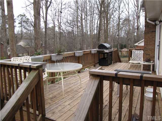 103 Dabney Road Cary, NC 27511 - Photo 21 of 25 a balcony with wooden floor table and chairs