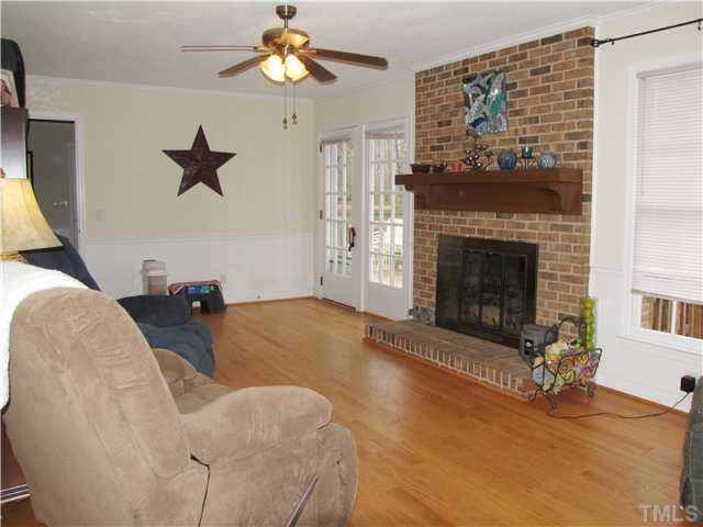 103 Dabney Road Cary, NC 27511 - Photo 6 of 25 a living room with furniture and a fireplace