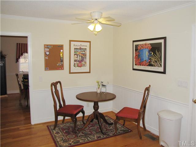 103 Dabney Road Cary, NC 27511 - Photo 10 of 25 a view of a dining room with furniture and wooden floor
