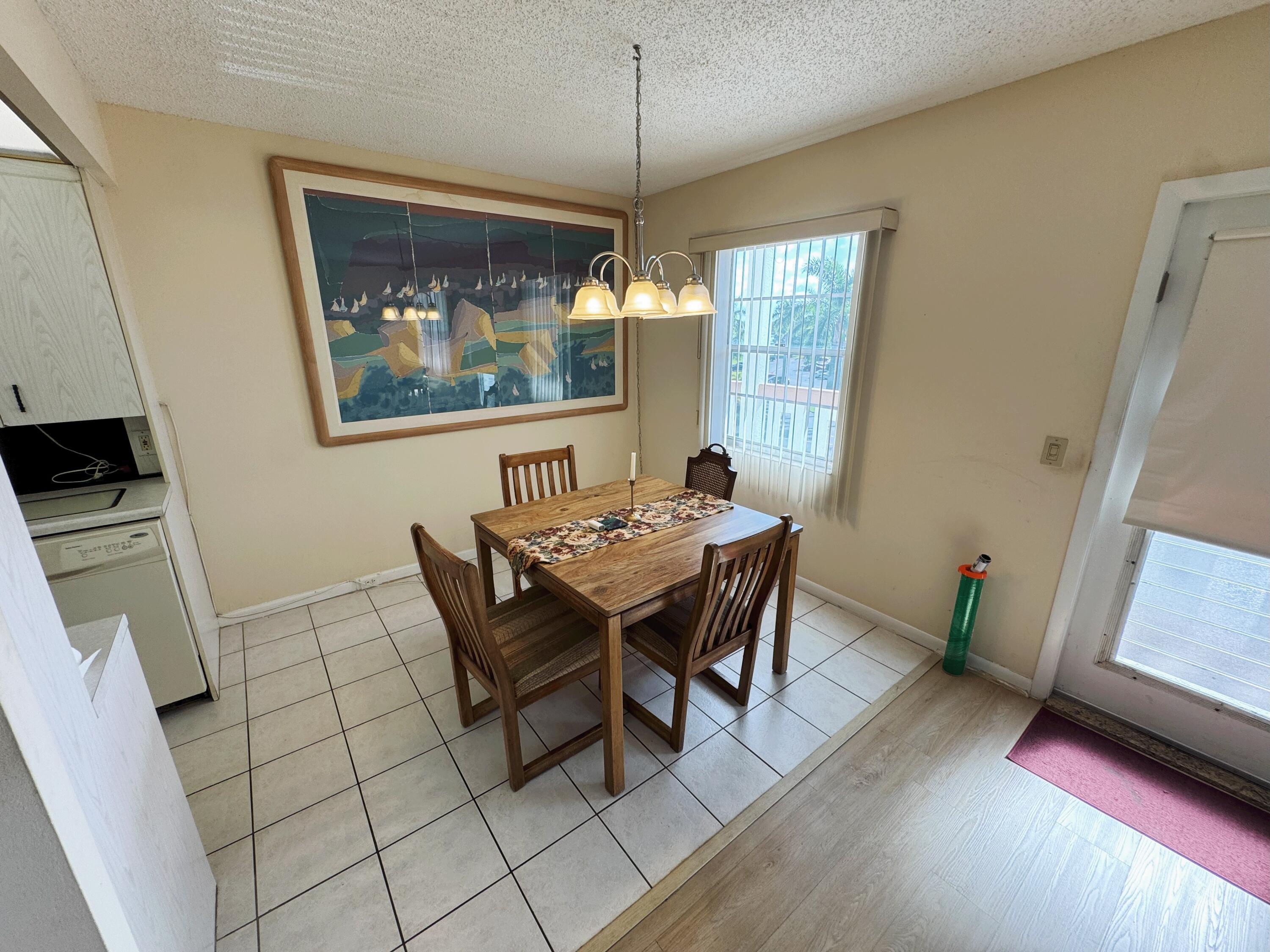 4075 Cornwall East Boca Raton, FL 33434 - Photo 5 of 30 a dining room with furniture and window