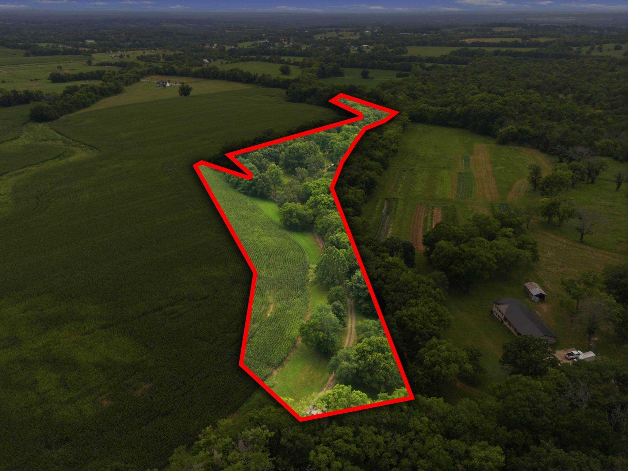145 Crenshaw Road Bethpage, TN 37022 - Photo 31 of 34 an aerial view of a house with a yard and lake view