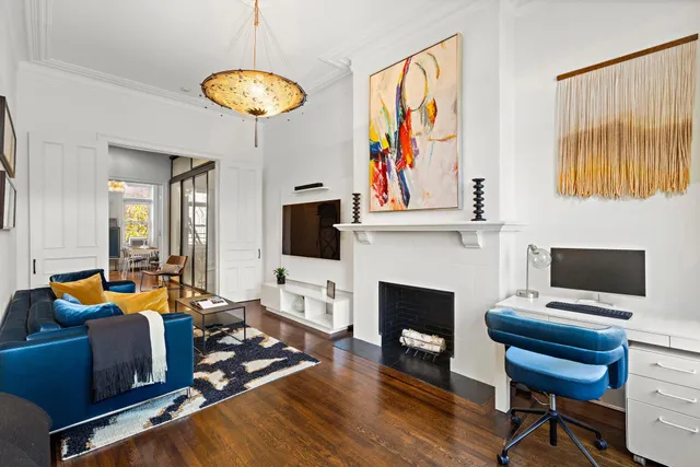 a living room with furniture fireplace and flat screen tv