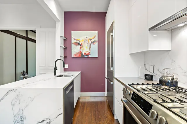a kitchen with a stove and a sink