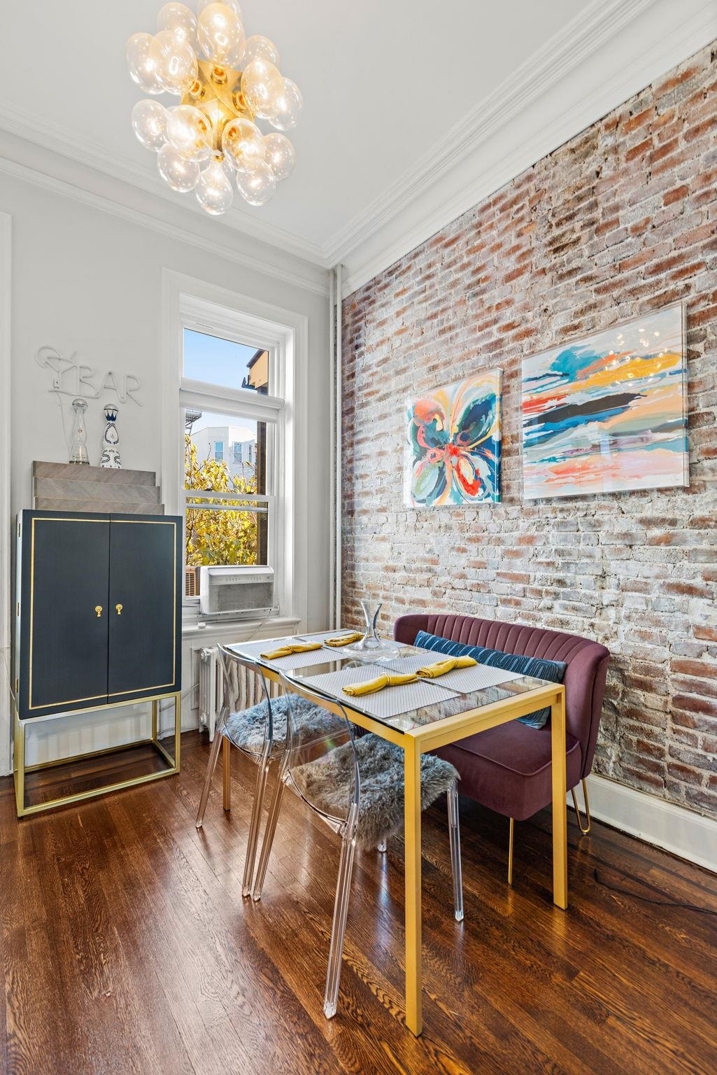937 Washington Street, Unit 2 Hoboken, NJ 07030 - Photo 15 of 21 a dining room with furniture and wooden floor