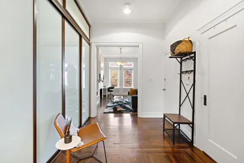 a view of a livingroom with furniture and entryway