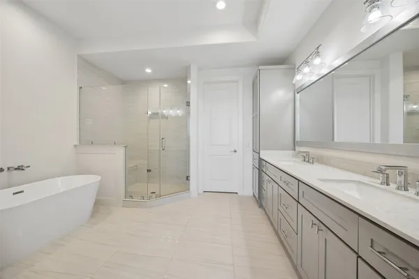 a bathroom with a bathtub and shower