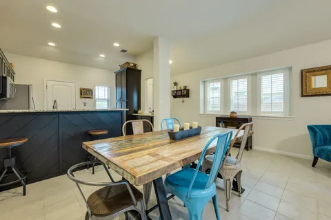 a view of a a dining room with furniture