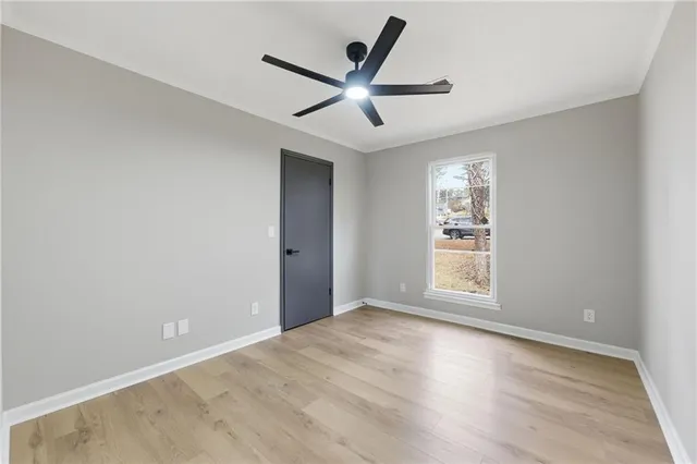 a view of an empty room with a window