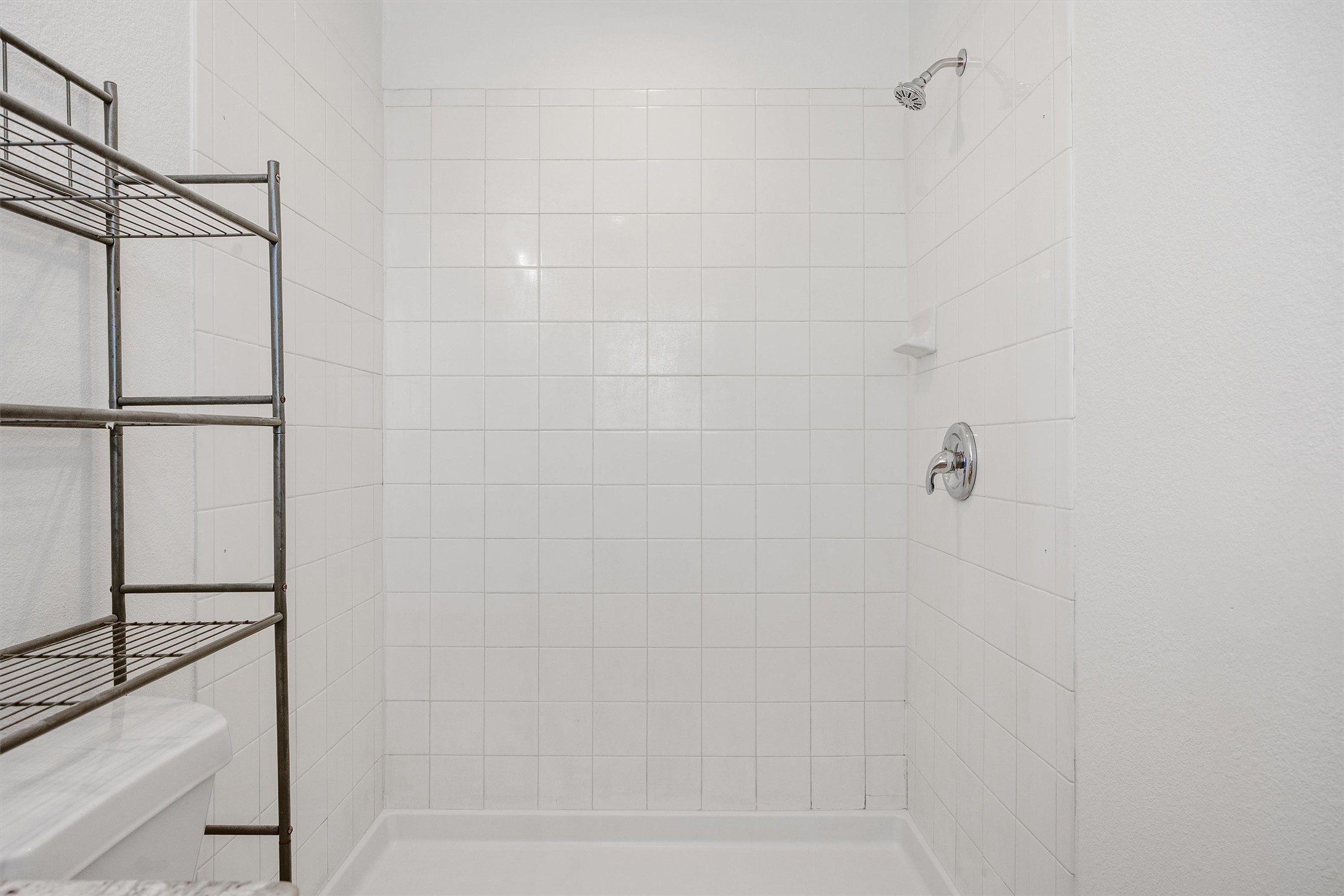 4516 Kind Way, Unit 253 Austin, TX 78725 - Photo 22 of 31 a bathroom with a shower
