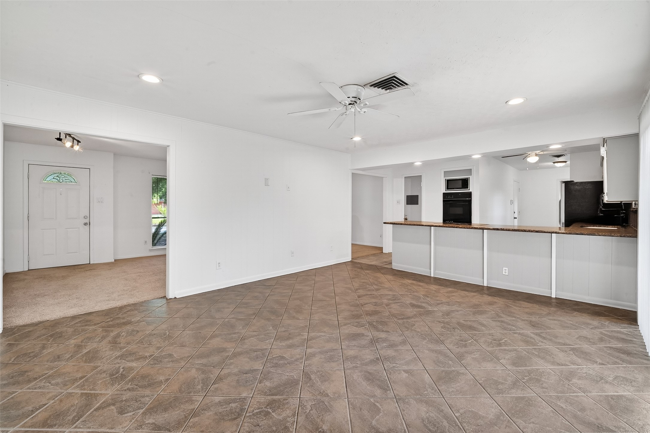5422 Spellman Road Houston, TX 77096 - Photo 7 of 27 a view of a kitchen with a sink and cabinet area