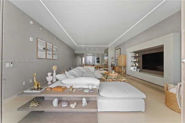 a bathroom with a bathtub shower sink vanity mirror and toilet